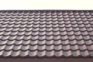 Modern roof covered with tile effect PVC coated metal roof sheets