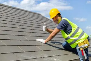 Roofer on Home Roof