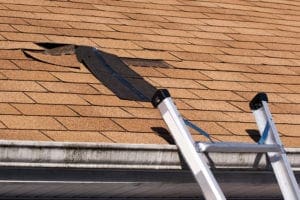 Fixing damaged roof shingles