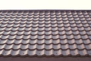 Modern roof covered with tile effect PVC coated metal roof sheets